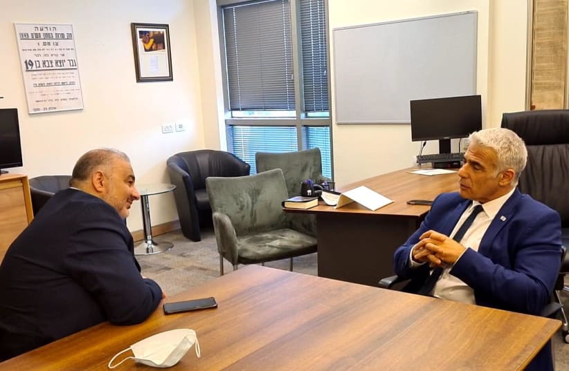Ra'am Party leader Mansour Abbas is seen meeting with Yesh Atid leader Yair Lapid. (photo credit: COURTESY YESH ATID)
