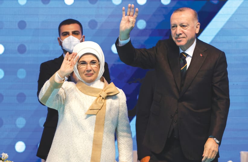 TURKISH PRESIDENT Recep Tayyip Erdogan and his wife greet their supporters during the Grand Congress of his ruling AK Party in Ankara last month. (photo credit: UMIT BEKTAS / REUTERS)