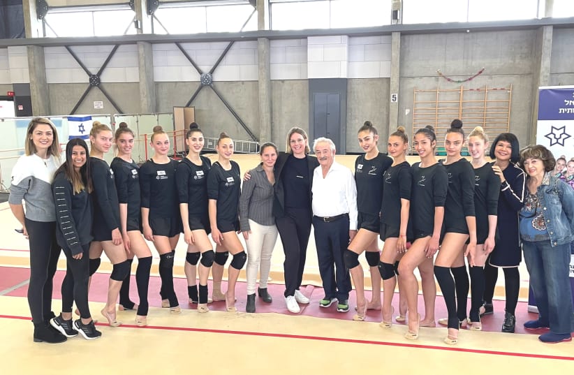 THE ISRAEL RHYTHMIC GYMNASTICS TEAM poses with Adv. Inbar Nacht, President of Nacht Philanthropic Ventures, which is a new sponsor of the team in its quest for an Olympic medal in Tokyo. (photo credit: Courtesy)