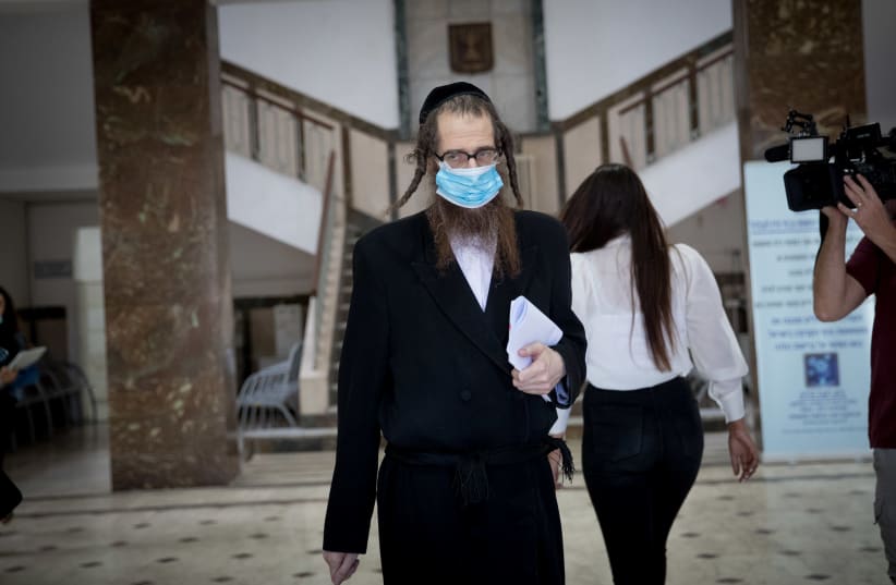 Eliezer Rumpler, from the Lev Tahor Haredi Jewish sect   arrives to the Jerusalem District Court for a court hearing on May 26, 2020. (photo credit: YONATAN SINDEL/FLASH 90)