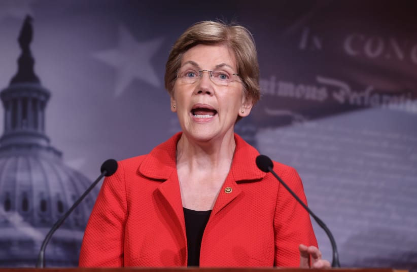 US Senator Elizabeth Warren (D-MA) speaks to reporters during a news conference on Democrats' demand for an extension of eviction protections in the next coronavirus disease (COVID-19) aid bill on Capitol Hill in Washington. (photo credit: REUTERS / JONATHAN ERNST)