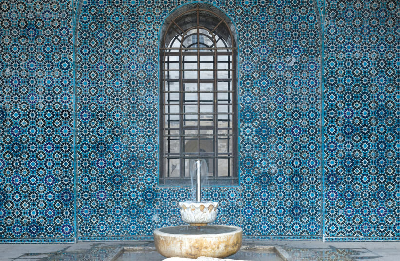 The mosaic designed for the Rockefeller Museum by Armenian artisan David Ohanessian decorates a fountain niche juxtaposed with larger-than-life ceramic beads created by Bezalel students (photo credit: Courtesy)