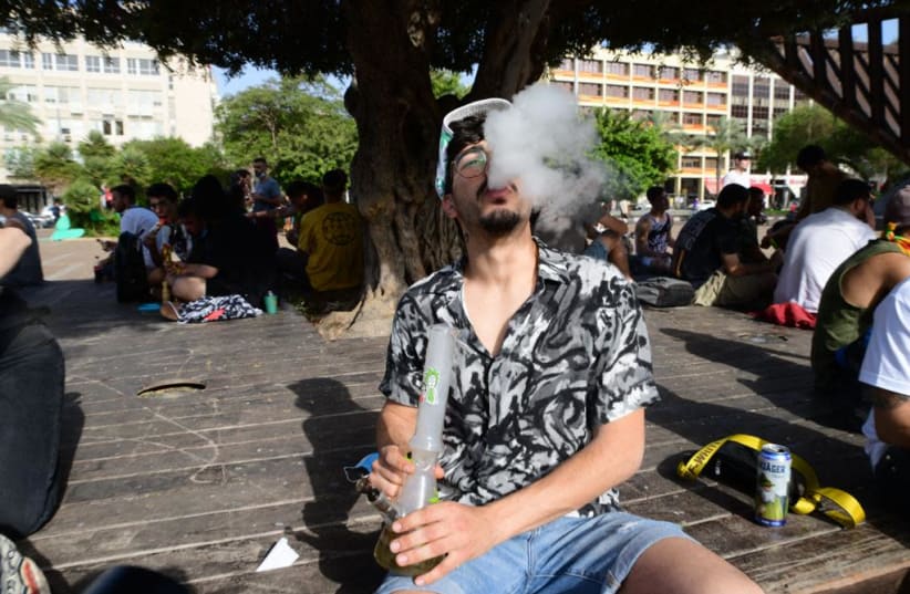 Hundreds of Israelis gather in Rabin Square in Tel Aviv on April 20, 2021to protest in favor of cannabis legalization and for reforms in the medical cannabis market. (photo credit: AVSHALOM SASSONI/ MAARIV)
