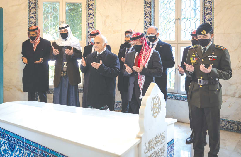 JORDAN’S KING Abdullah II and members of the royal family pray at tombs of royalty in the Raghdan Palace in Amman earlier this month. (photo credit: JORDANIAN ROYAL PALACE/REUTERS)