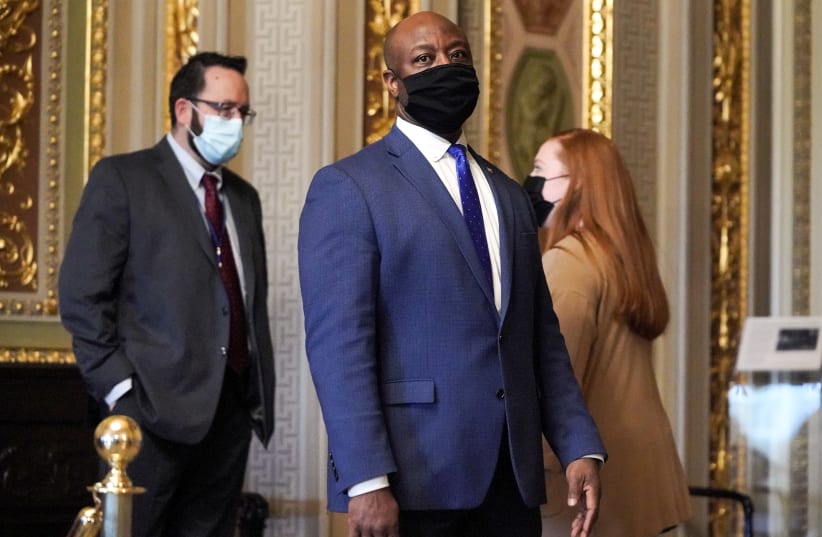 US Senator Tim Scott (R-SC) is seen in the Senate Reception room during the fifth day of the impeachment trial of former US President Donald Trump in Washington, US, February 13, 2021.  (photo credit: GREG NASH/POOL VIA REUTERS)
