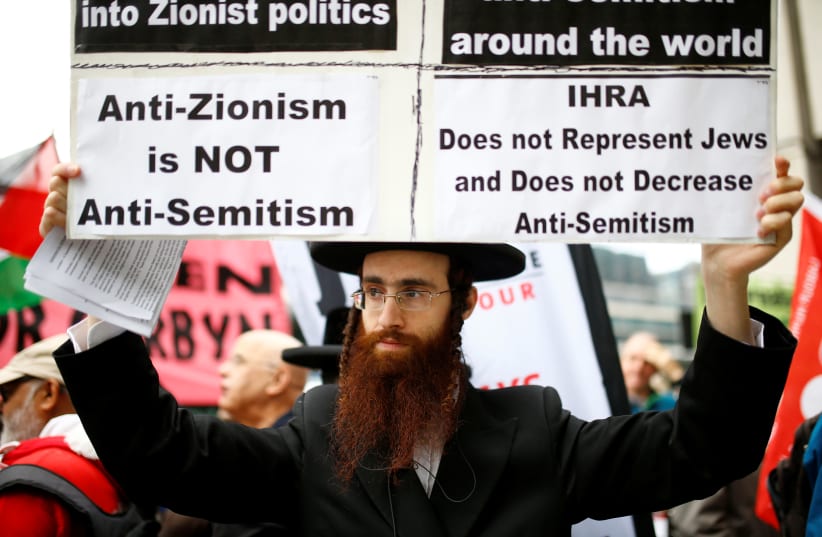 PROTESTING OUTSIDE a meeting of the British Labour Party’s National Executive, which was set to discuss the party’s definition of antisemitism, in London in September 2018 (photo credit: HENRY NICHOLLS/REUTERS)