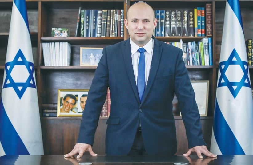 NAFTALI BENNETT in his office. The Yamina Party leader now represents the sane right wing in the political arena. (photo credit: MARC ISRAEL SELLEM/THE JERUSALEM POST)