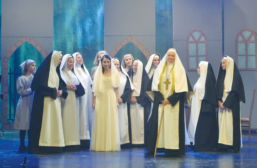 THE NUNS welcome Maria (Netta Druckman) on her wedding day in LOGON’S ‘The Sound of Music.’ (photo credit: AVITAL COHEN)