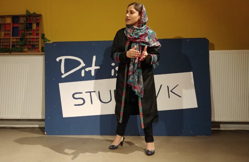 Raziya Masumi talks about her life in Afghanistan and her advocacy to prevent violence against women during a storytelling meeting in Amsterdam. (photo credit: TORI EGHERMAN)