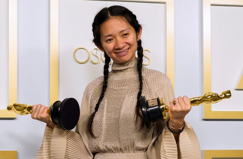 Chloe Zhao, winner of the award for Best Picture for "Nomadland," poses in the press room at the Oscars, in Los Angeles, California, U.S., April 25, 2021.  (photo credit: REUTERS)
