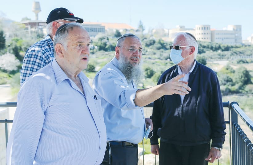 AVRAHAM DUVDEVANI (left), chairman of the KKL-JNF, and Gush Etzion Regional Council head Shlomo Ne’eman (center) attend a ceremony for a new memorial monument for victims of the Nebi Samwil convoy in Neveh Daniel in February. (photo credit: GERSHON ELINSON/FLASH90)