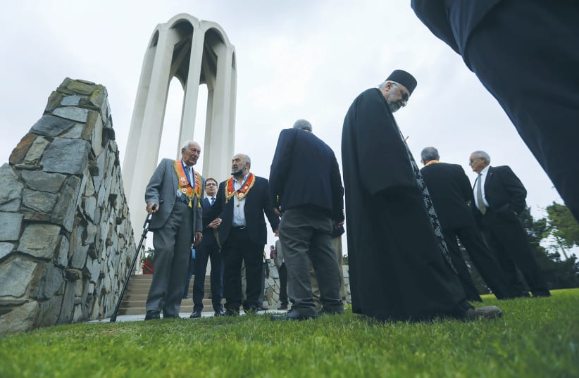MEMBERS OF the Armenian diaspora in the US gather last week in remembrance of the 1915 genocide, which was acknowledged by US President Joe Biden, at the Armenian Martyrs Memorial Monument in Montebello, California.  (photo credit: DAVID SWANSON/REUTERS)