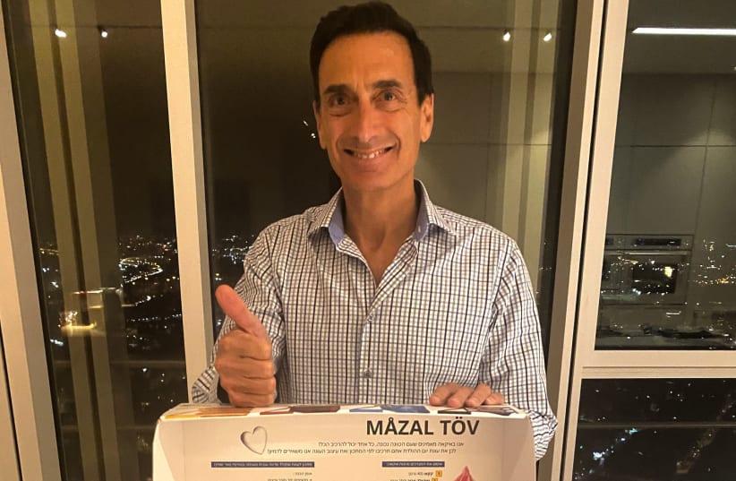 Matthew Bronfman, one of the owners of IKEA in Israel, receives his celebratory gift basket from IKEA. (photo credit: Courtesy)