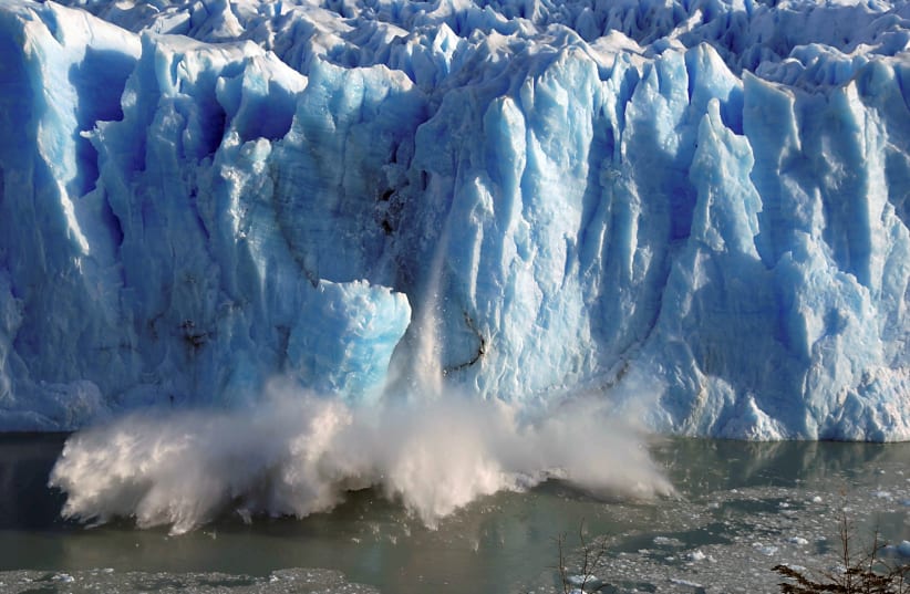 Splinters of ice peel off from one of the sides of the Perito Moreno glacier near the city of El Calafate in the Patagonian province of Santa Cruz, southern Argentina, July 7, 2008.  (photo credit: REUTERS/ANDRES FORZA)