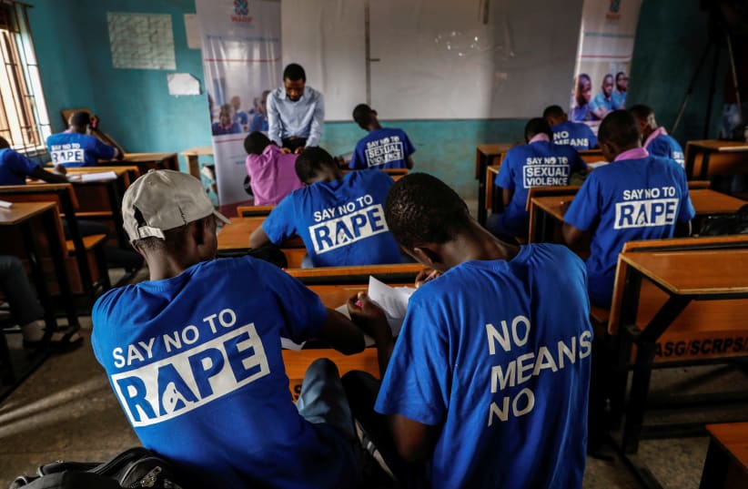 Students are seen in a classroom as they receive lectures about prevention of sexual violence by a representative of Women at Risk International Foundation (WARIF) at Oregun High School, in Lagos, Nigeria March 31, 2021. Picture taken March 31, 2021.  (photo credit: REUTERS/TEMILADE ADELAJA)