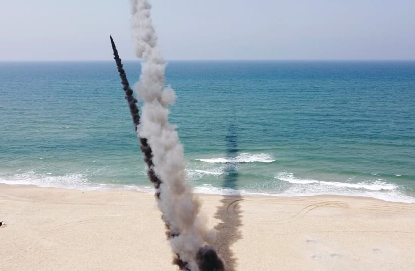 Rockets are launched into the Mediterranean Sea off the Gaza Strip during an anti-Israel military drill by the Palestinian Mujahideen Brigades earlier this month, according to Reuters. Image taken from a video shot with a drone. (photo credit: MOHAMMED SALEM/REUTERS)