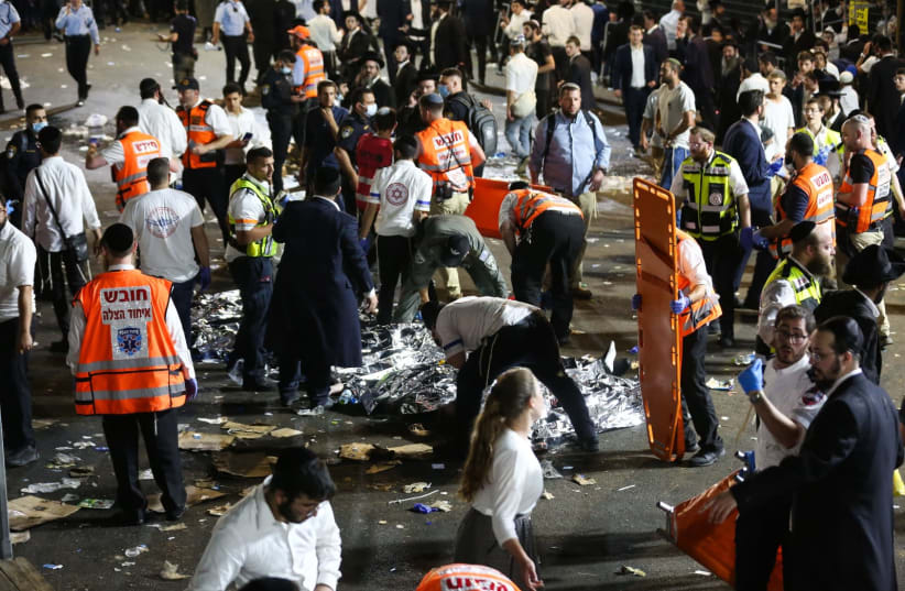 Israeli rescue forces and police near the scene after a stampede killed dozens during the celebrations of the Jewish holiday of Lag Baomer on Mt. Meron, in northern Israel on April 30, 2021 (photo credit: DAVID COHEN/FLASH 90)