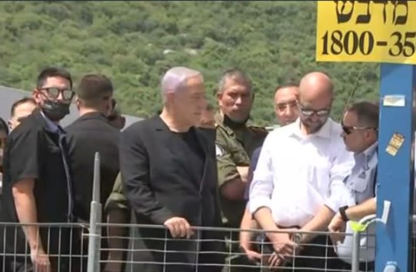 Prime Minister Benjamin Netanyahu visiting Mount Meron after the Lab Ba'omer tragedy, April 30, 2021 . (photo credit: SCREENSHOT FROM N12)