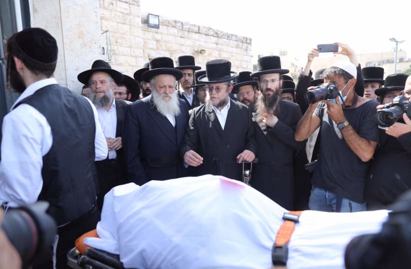 The funeral of a victim of the Mount Meron tragedy that took place on Lag B'Omer, April 2021. (photo credit: MARC ISRAEL SELLEM/THE JERUSALEM POST)