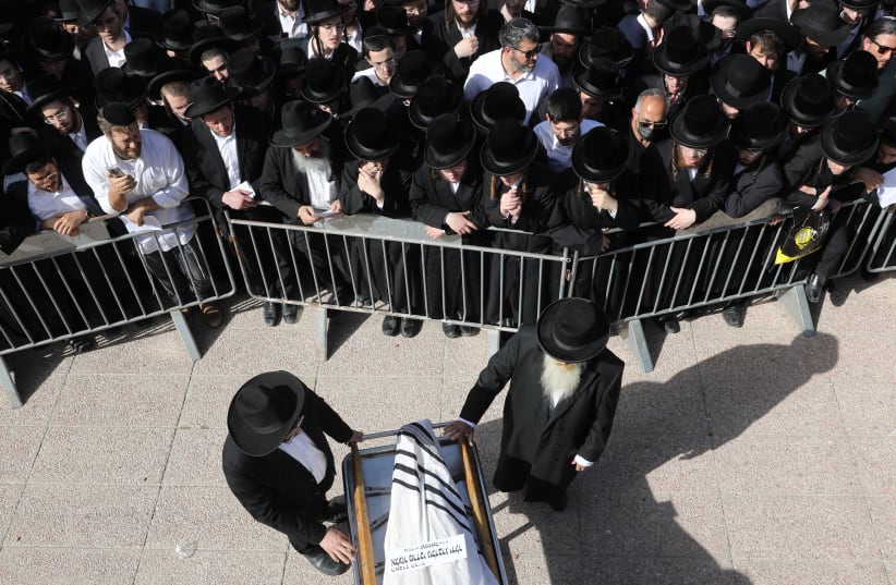 Mourners gather at a funeral for one of the victims of the 45 deceased of the Mount Meron tragedy, Lag Ba'omer, 2021. (photo credit: MARC ISRAEL SELLEM/THE JERUSALEM POST)