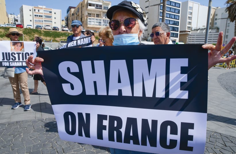 PROTESTORS GATHER outside the French Embassy in Tel Aviv on Sunday to demand justice for Sarah Halimi, who was murdered by an antisemitic assailant in her apartment in Paris in 2017. (photo credit: AVSHALOM SASSONI/FLASH90)