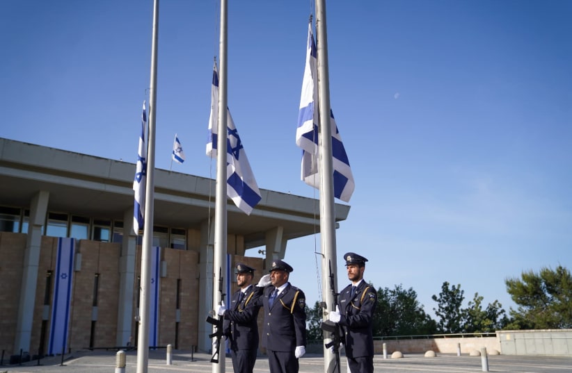 Flags at the Knesset were lowered to half mast in memory of the victims of the Meron disaster in a special ceremony at the Knesset on Sunday morning. (photo credit: NOAM MOSKOVICH)