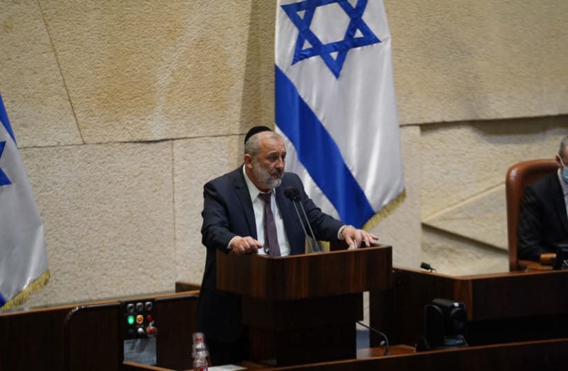Interior Minister Arye Deri is seen addressing the Knesset plenum on May 3, 2021. (photo credit: DANI SHEM TOV/KNESSET SPOKESPERSONS OFFICE)