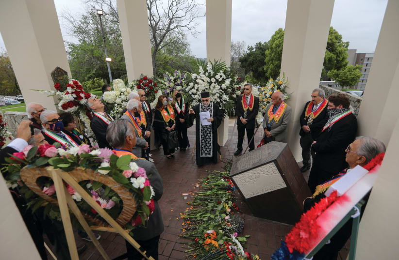 FATHER SARKIS PETOYAN from Saint Gregory The Illuminator Armenian Apostolic Church and members of the Armenian diaspora in the US gather in remembrance of the 1915 genocide, which was acknowledged by US President Joe Biden, at the Armenian Martyrs Monument in Montebello, California, last month. (photo credit: DAVID SWANSON/REUTERS)