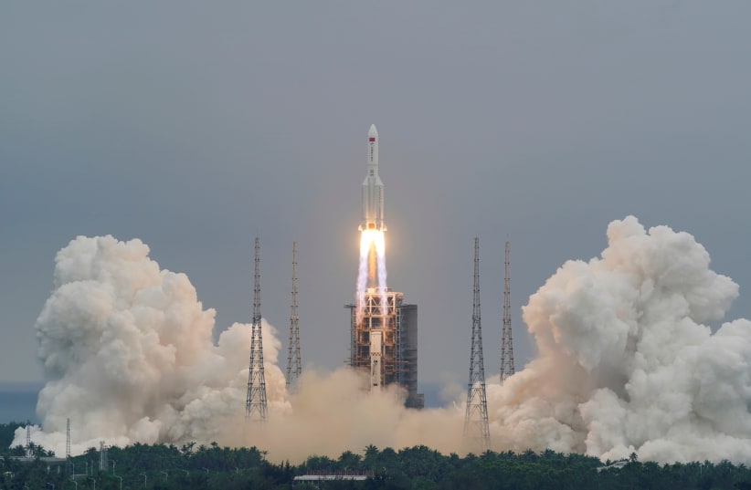Long March-5B Y2 rocket, carrying the core module of China's space station Tianhe, takes off from Wenchang (photo credit: CHINA DAILY VIA REUTERS)