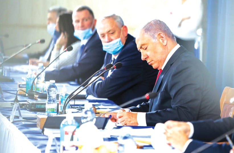 PRIME MINISTER Benjamin Netanyahu leads the weekly cabinet meeting in Jerusalem last June. (photo credit: MARC ISRAEL SELLEM/THE JERUSALEM POST)