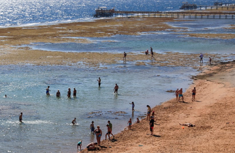 TOURISTS AT the Red Sea resort of Sharm e-Sheikh, in February. The book tries to decipher where the sea split for Moses (photo credit: AMR ABDALLAH DALSH / REUTERS)