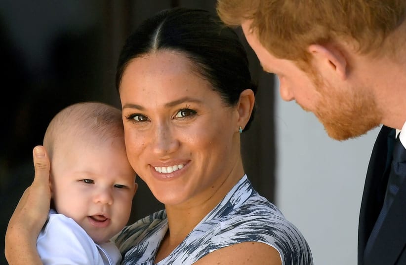 Britain's Prince Harry and his wife, Duchess Meghan with their son Archie (photo credit: REUTERS)