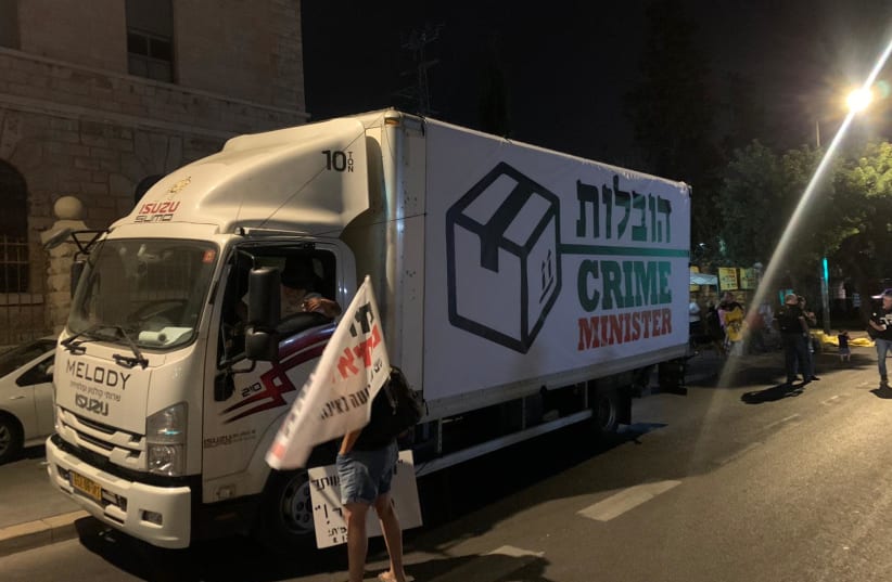A fake moving truck titled "Crime Minister Movers" on Balfour comes to "Take Bibi home" (photo credit: Courtesy)
