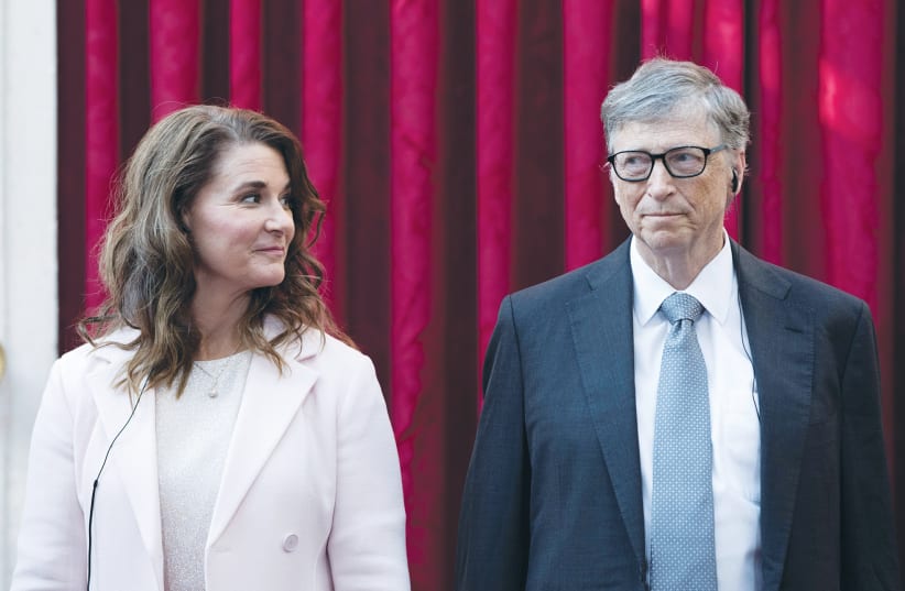 PHILANTHROPIST AND co-founder of Microsoft Bill Gates and his wife, Melinda, at the Elysee Palace in Paris, in 2017. (photo credit: KAMIL ZIHNIOGLU/REUTERS)