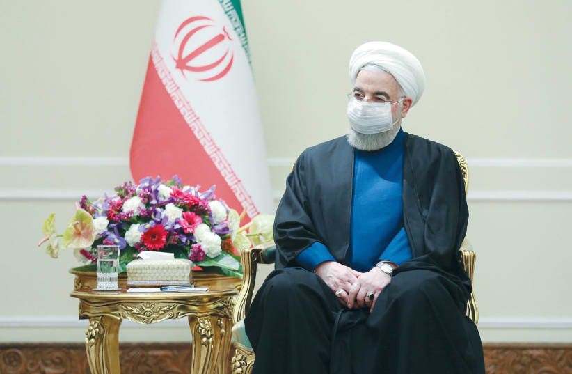 IRANIAN PRESIDENT Hassan Rouhani waits to meet with Russia’s Foreign Minister Sergei Lavrov, in Tehran last month. (photo credit: IRANIAN PRESIDENCY OFFICE/WANA (WEST ASIA NEWS AGENCY)/HANDOUT VIA REUTERS)