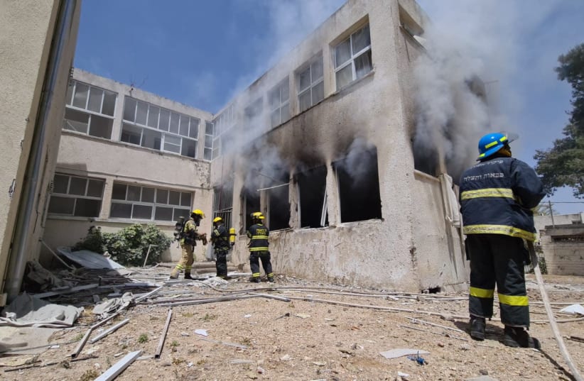Smoke and flames rise after an Gaza rocket hit a school in Ashkelon (photo credit: FIRE AND RESCUE SERVICE)