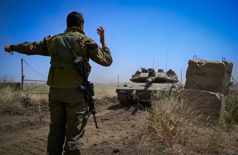 Israeli soldiers prepare to move down south on  May 11, 2021, El Poran, Golan Heights.  (photo credit: MICHAEL GILADI/FLASH90)