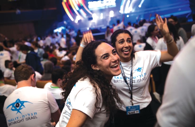 YOUNG JEWS from across the world attend the main annual Taglit Birthright event at the Jerusalem International Conference Center in 2017. (photo credit: HADAS PARUSH/FLASH90)