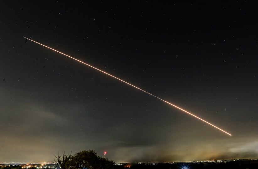 A rocket is seen being fired into Israel from the Gaza Strip, on May 12, 2021. (photo credit: EDI ISRAEL/FLASH90)