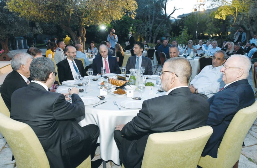 PRESIDENT REUVEN RIVLIN with Muslim ambassadors and local Arab leaders at the Iftar dinner that he hosted at the President’s Residence. (photo credit: MARK NEYMAN/GPO)