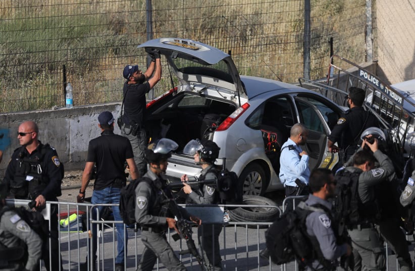 Police at the scene of a car ramming attack in east Jerusalem, with several injuries. The terror attack occurred in the Sheikh Jarrah neighborhood of east Jerusalem, on May 16, 2021. (photo credit: YONATAN SINDEL/FLASH 90)