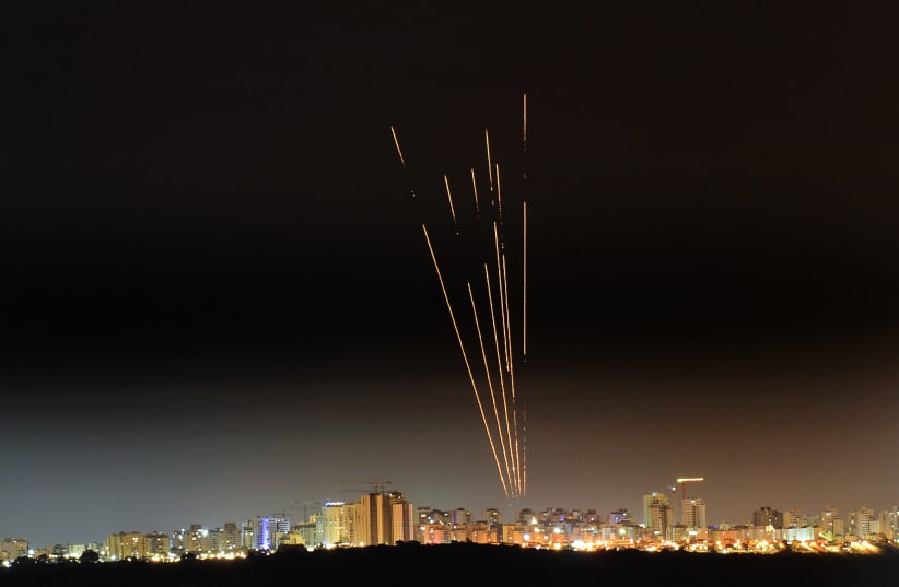 A long exposure picture shows iron dome anti-missile system fires interception missile as rockets fired from the Gaza Strip to Israel, as seen from the southern Israeli city of Ashkelon May 17, 2021. (photo credit: AVI ROCCAH/FLASH90)