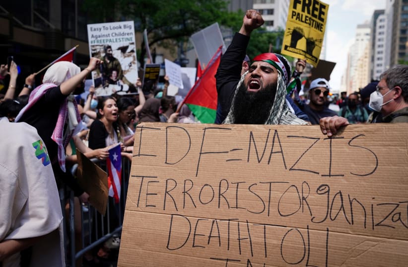 Pro-Palestinian supporters demonstrate near the Israeli Consulate following the flare-up of Israeli-Palestinian violence, in the Manhattan borough of New York City, New York, US, May 18, 2021. (photo credit: CARLO ALLEGRI/REUTERS)
