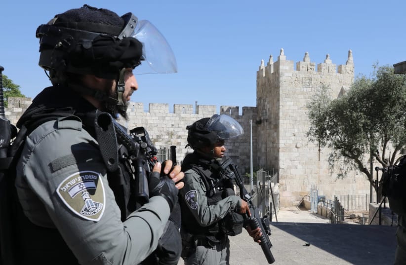 Israel Border Police officers stand guard at the Damascus Gate (photo credit: MARC ISRAEL SELLEM)