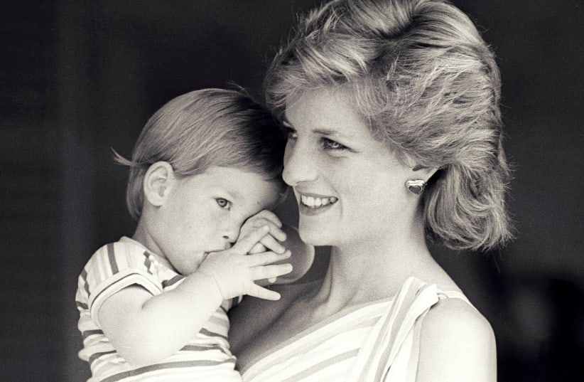 Britain's Princess Diana holds Prince Harry during a morning picture session at Marivent Palace, where the Prince and Princess of Wales are holidaying as guests of King Juan Carlos and Queen Sofia in Mallorca (photo credit: REUTERS)