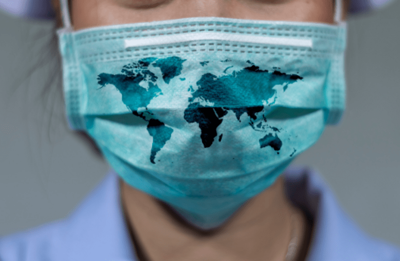 A woman wears a protective mask during the coronavirus pandemic (photo credit: TEL AVIV UNIVERSITY)