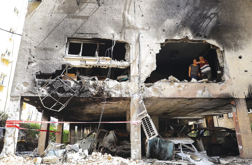 DAMAGE TO homes in Petah Tikva from rockets fired from Gaza during the current round of fighting between Israel and Hamas. (photo credit: FLASH90)