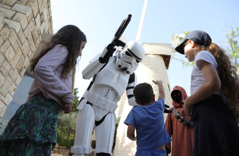 Volunteers from Israel's 501st Outpost meet with children (photo credit: MARC ISRAEL SELLEM)