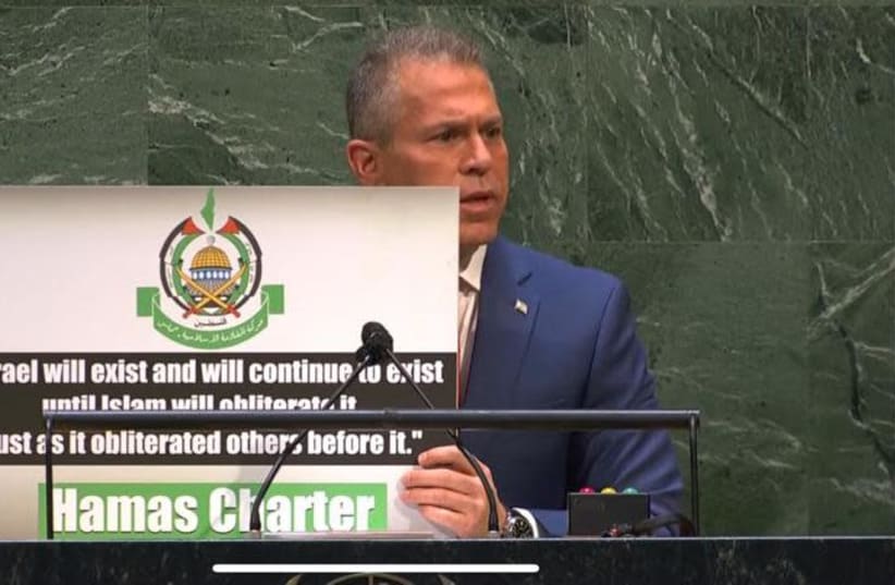 Ambassador Gilad Erdan is seen holding a graphic about Hamas while speaking to the UN General Assembly, on May 20, 2021. (photo credit: Courtesy)