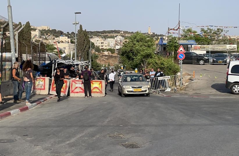 Israel Border Police are seen standing at the entrance to Sheikh Jarrah at a joint Jewish and Arab demonstration, May 21, 2021 (photo credit: NIV BEILI)